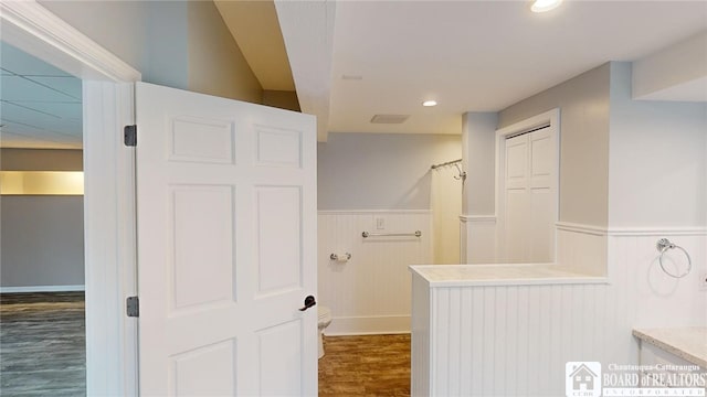 bathroom with wood-type flooring