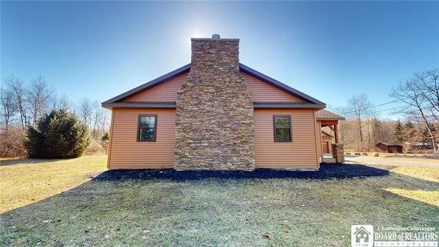 view of property exterior featuring a lawn