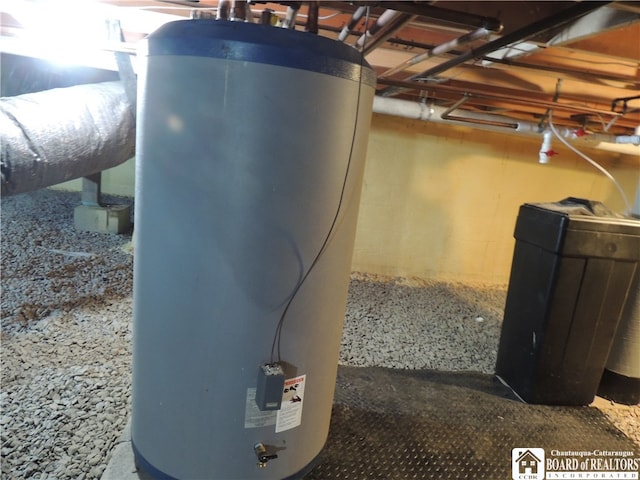 utility room featuring water heater