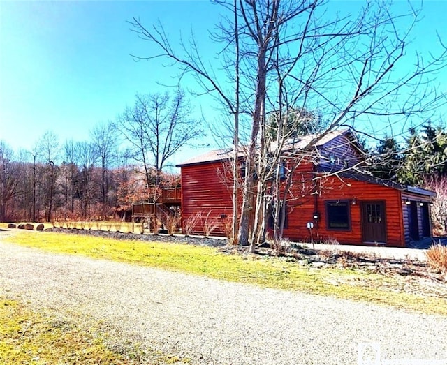 view of front of home featuring a wooden deck