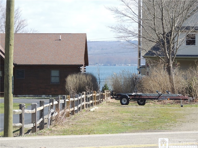 view of side of home featuring a water view