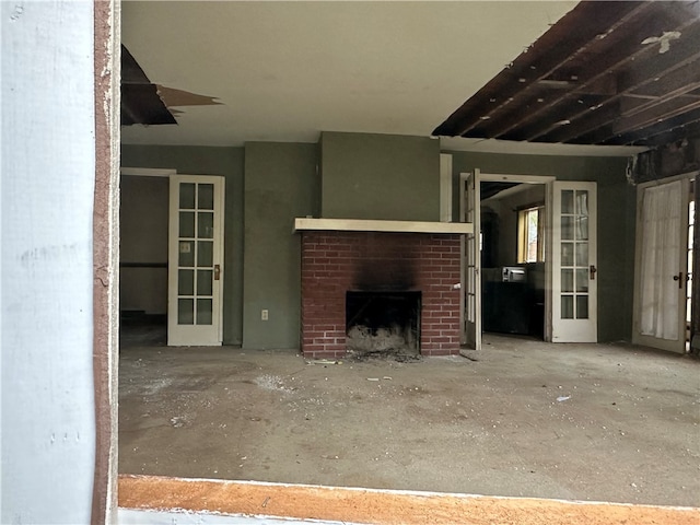 unfurnished living room with a brick fireplace