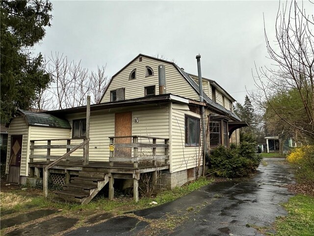 630 W Gray St, Elmira-City, NY 14905 - colonial inspired home with a gambrel roof and a deck