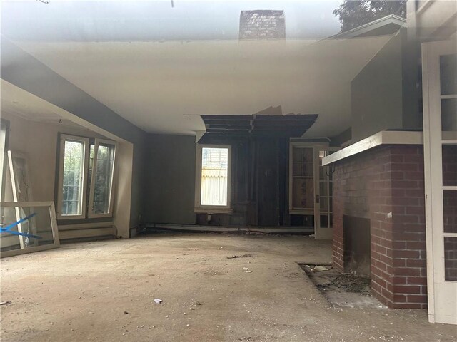 630 W Gray St, Elmira-City, NY 14905 - unfurnished living room featuring plenty of natural light and a fireplace