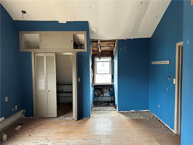 630 W Gray St, Elmira-City, NY 14905 - unfurnished bedroom with a textured ceiling and a closet