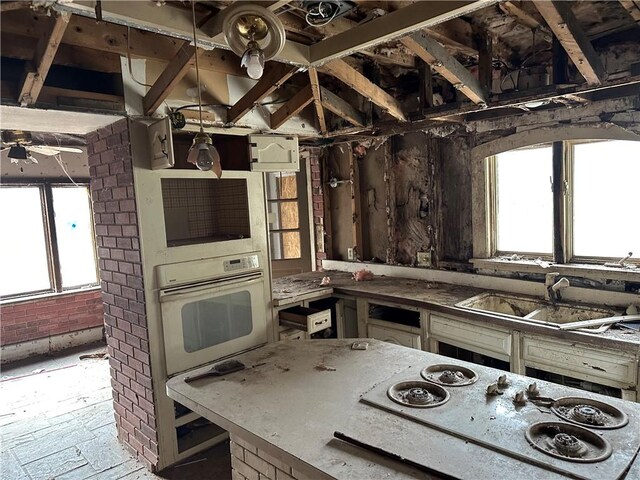 630 W Gray St, Elmira-City, NY 14905 - kitchen with white appliances, a sink, and healthy amount of natural light