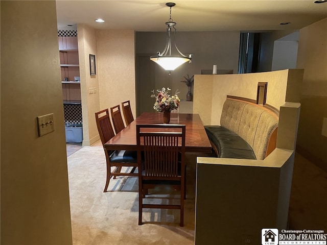 view of carpeted dining area