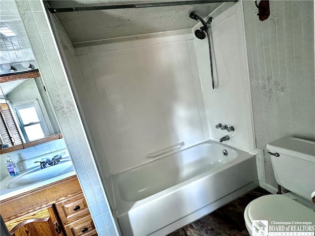 full bathroom with shower / washtub combination, vanity, and toilet