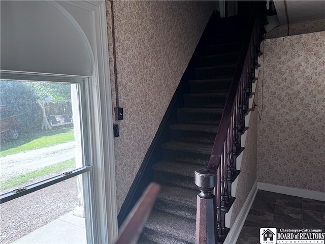 stairway with tile patterned flooring