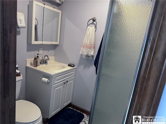 bathroom with vanity and toilet