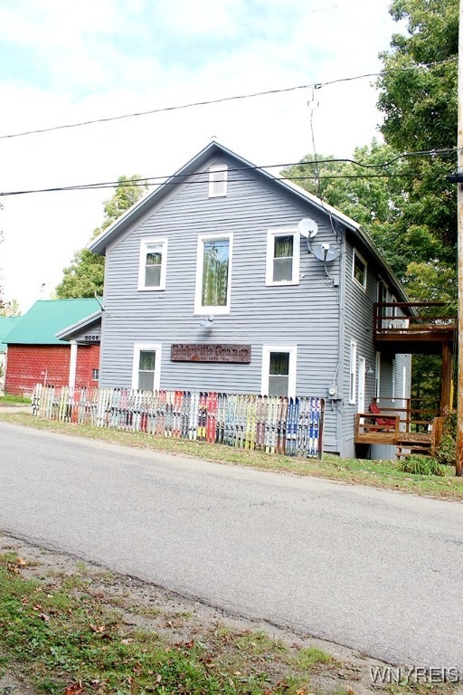 view of side of property with a balcony