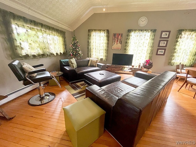 living room featuring light hardwood / wood-style flooring, a wealth of natural light, lofted ceiling, and crown molding