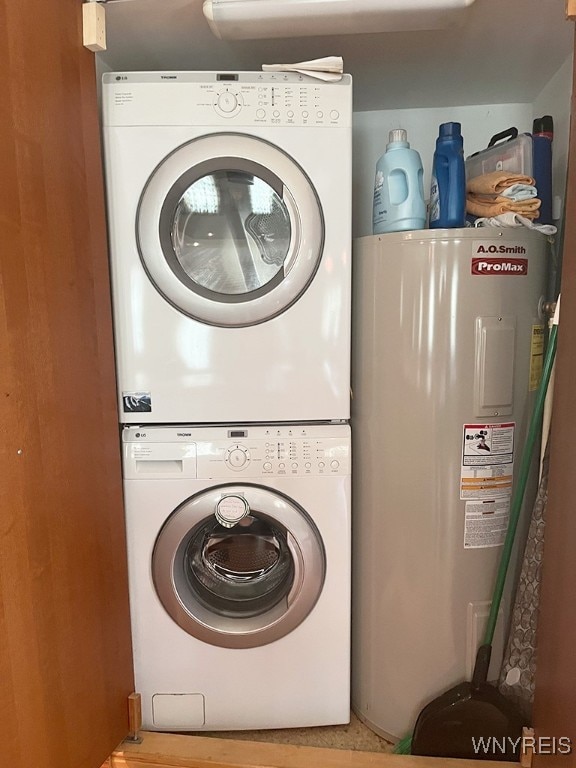 washroom featuring electric water heater and stacked washer and clothes dryer