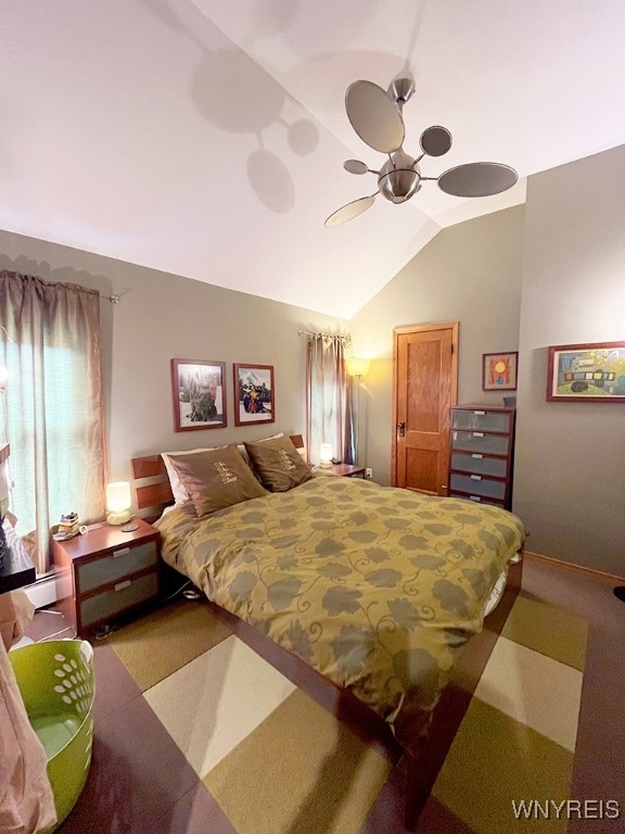 carpeted bedroom featuring lofted ceiling and ceiling fan