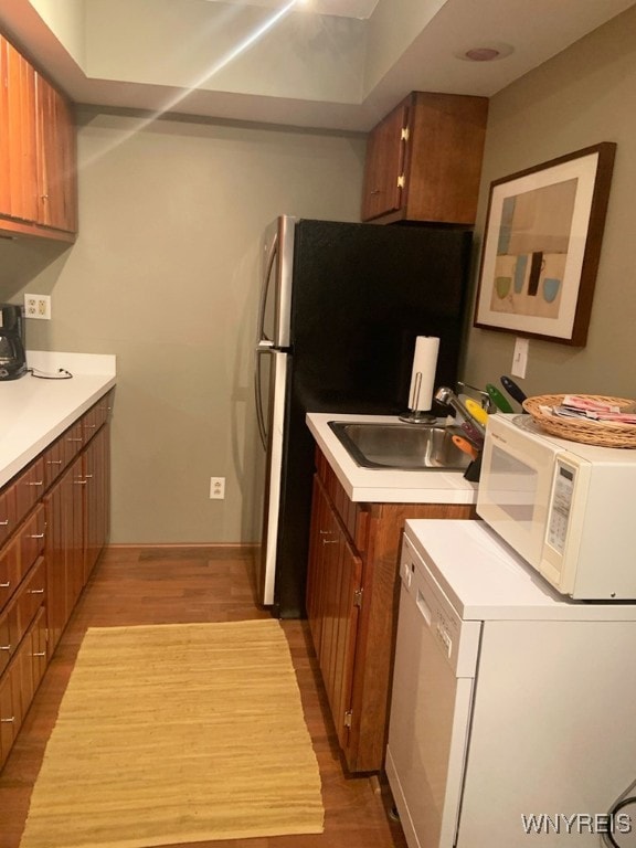 kitchen with light wood-type flooring and sink