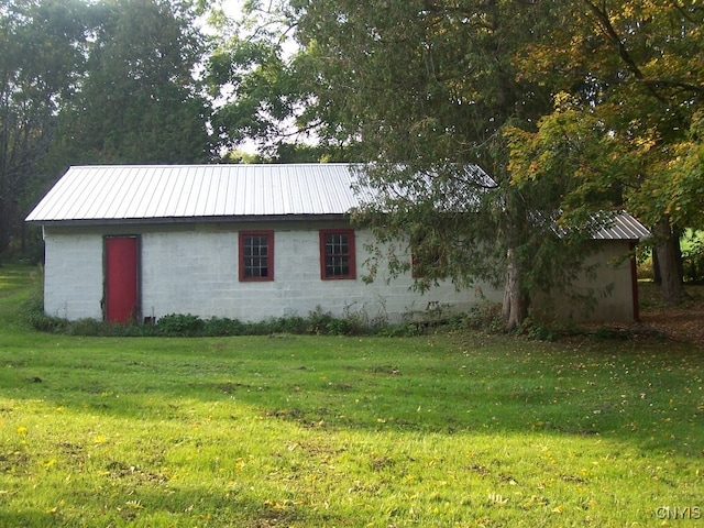 view of home's exterior featuring a lawn