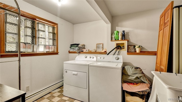 laundry room featuring independent washer and dryer, a baseboard heating unit, and sink