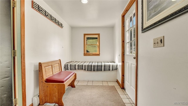 hallway featuring light tile patterned flooring