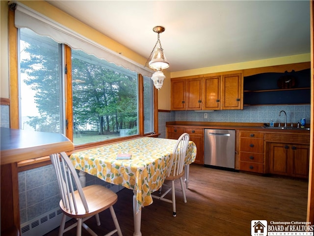 dining area featuring dark hardwood / wood-style floors and sink