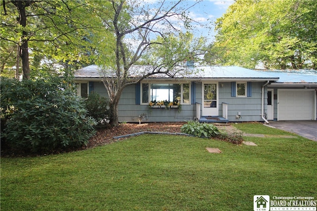 ranch-style house with a front yard and a garage