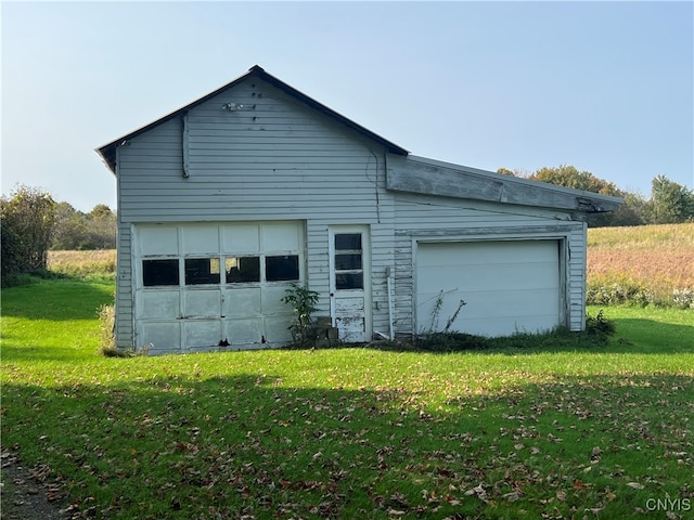 garage with a lawn