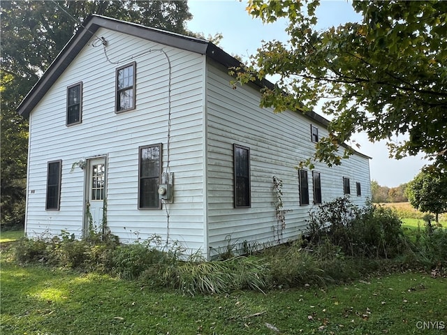 rear view of house with a lawn