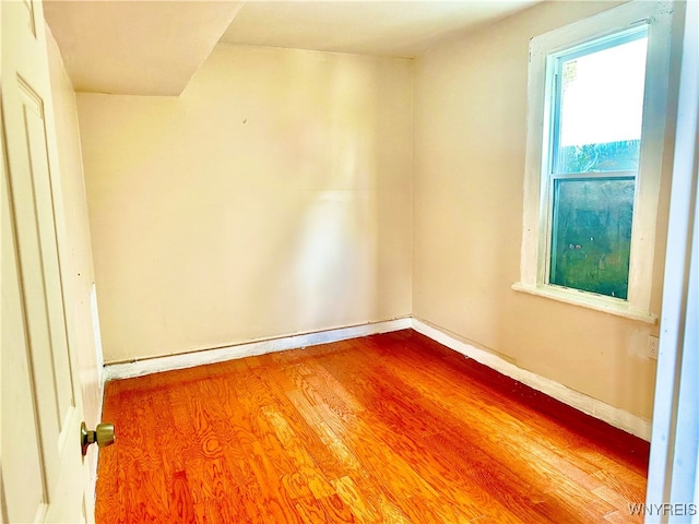 spare room with hardwood / wood-style floors