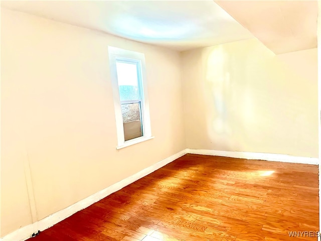 empty room featuring hardwood / wood-style flooring