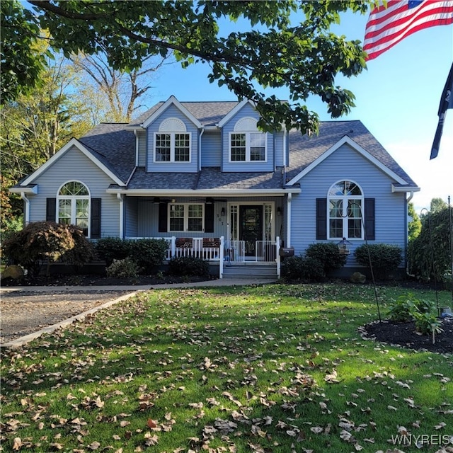 view of front of home with covered porch and a front yard