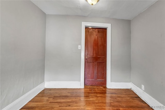 empty room featuring hardwood / wood-style flooring