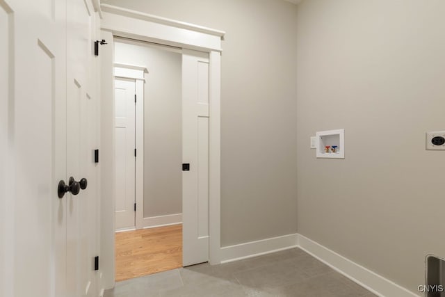 clothes washing area with washer hookup, light wood-type flooring, and electric dryer hookup