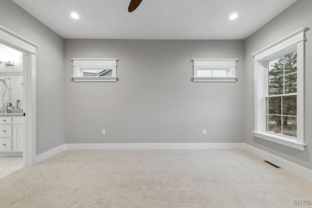 carpeted empty room with ceiling fan