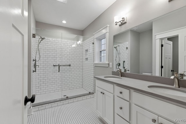 bathroom with tile patterned flooring, vanity, toilet, and an enclosed shower