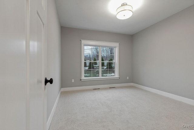 unfurnished room with carpet flooring