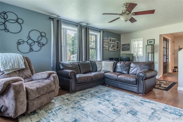 living room with hardwood / wood-style flooring and ceiling fan