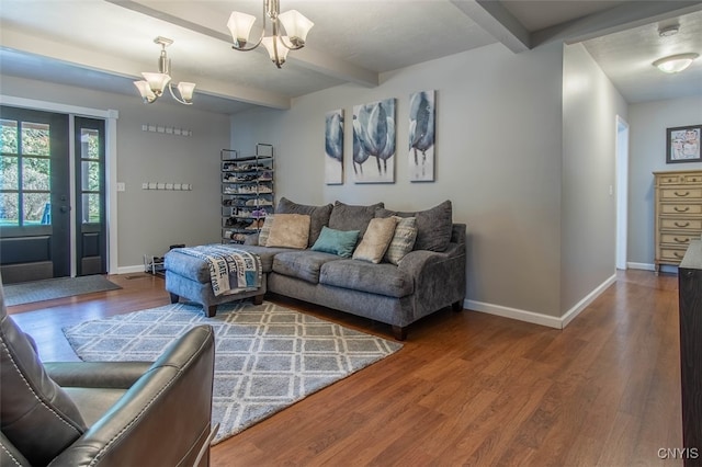 living room with beam ceiling, hardwood / wood-style floors, and an inviting chandelier