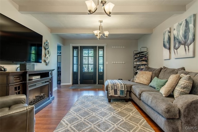 living room featuring beam ceiling, wood-type flooring, and a notable chandelier