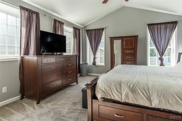 carpeted bedroom with ceiling fan and lofted ceiling