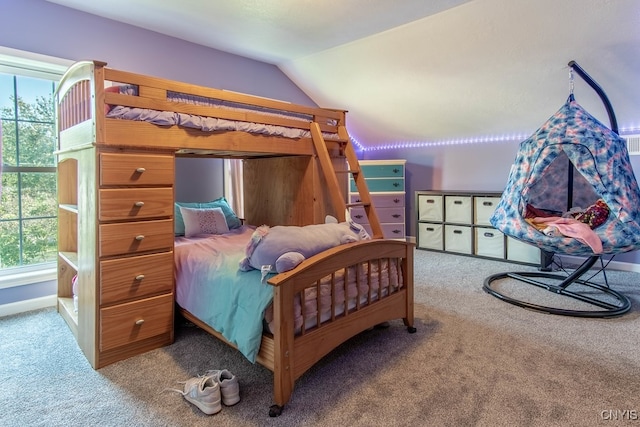 carpeted bedroom with lofted ceiling