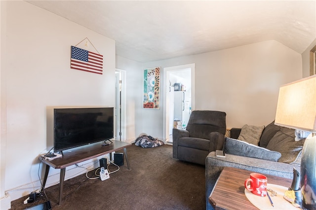 carpeted living room featuring lofted ceiling