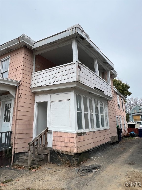 view of property exterior featuring a balcony