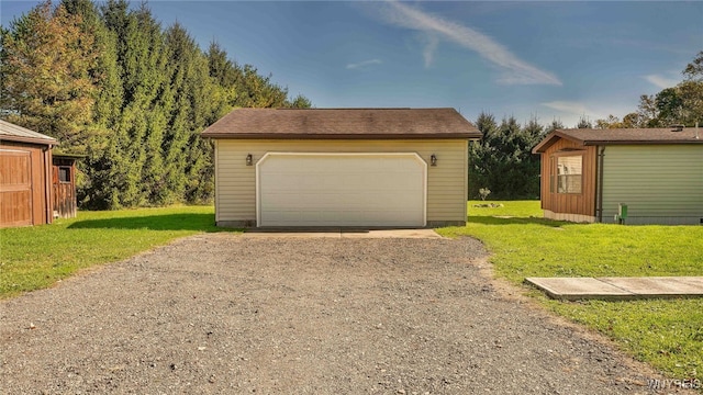 garage featuring a yard