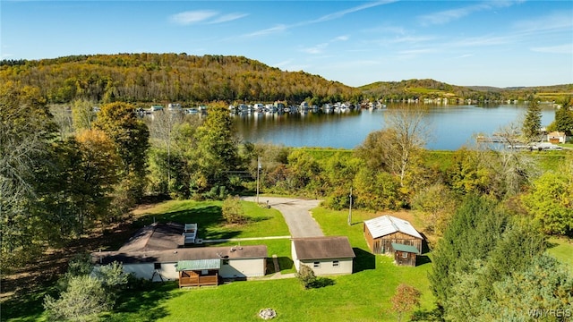 drone / aerial view featuring a water and mountain view