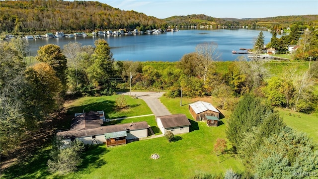 drone / aerial view featuring a water and mountain view