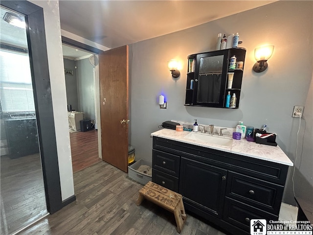 bathroom with vanity and hardwood / wood-style floors