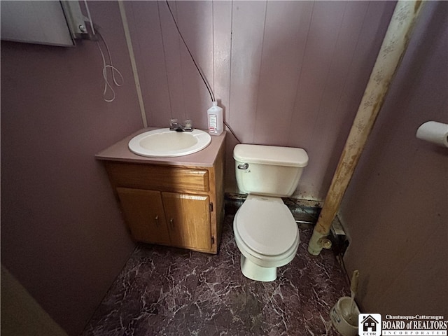 bathroom featuring vanity and toilet