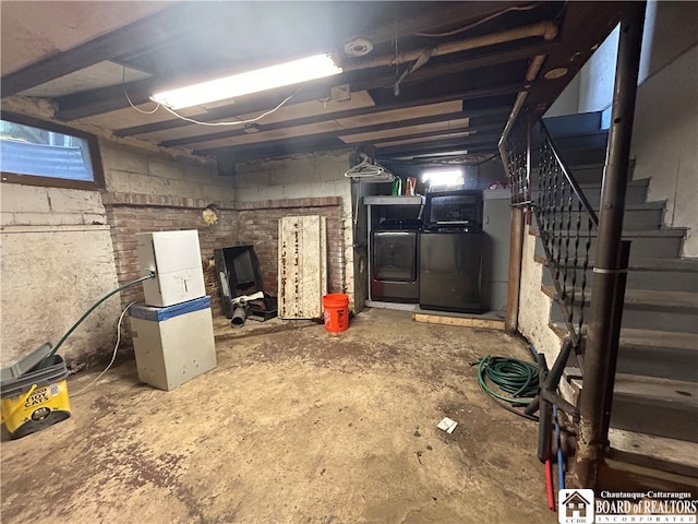 basement with washing machine and clothes dryer