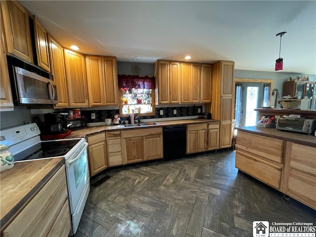 kitchen with hanging light fixtures, dishwasher, butcher block counters, white electric stove, and sink