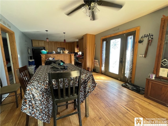 dining area featuring ceiling fan and light hardwood / wood-style floors