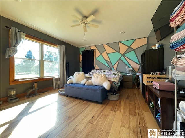 interior space featuring light hardwood / wood-style floors and ceiling fan